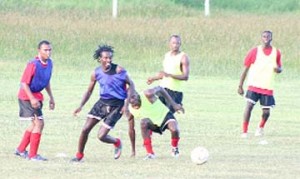Some members of the national football team caught training yesterday at the Guyana National Service ground on Carifesta Avenue.  (Orlando Charles photo)  