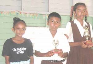 Second, third and fourth prize winners in the essay competition Arifa Hassain, Vyass Waidu and Shalini Persaud respectively. 
