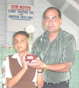 Narchand ‘Archie’ Mohan with the first prize winner of the essay competition, Ashme Lalchand. 