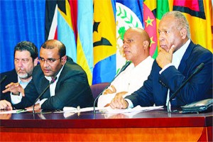Guyana President Bharrat Jagdeo, second from left, makes a point during Sunday’s news conference at the Diplomatic Centre. At left is St Vincent and the Grenadines Prime Minister Dr Ralph Gonsalves and Prime Minster of Belize, Dean Barrow and T&T Prime Minister Patrick Manning, right.