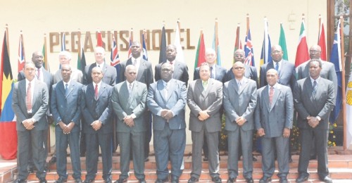 The 18 commissioners of police attending the 24th conference of the Association of Caribbean Commissions of Police stand in front of the Pegasus Hotel where the conference is being held.  (Photo by Jules Gibson)