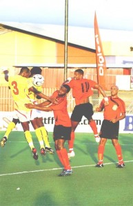 Flash Back! Guyana’s Howard Lowe (#3 yellow jersey) goes airborne for a header against Antigua in last year’s Digicel Caribbean Championship in Trinidad. Lowe will captain Guyana today against Antigua in the 2009 Parbo Bier Cup. 