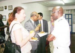 Commodore Gary Best in conversation with US Charge d’ Affaires Karen Williams