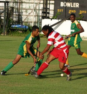 Hikers’ Jerry Bell (left) making a move past John Abrahams of Old Fort when the two met yesterday at the GCC ground. Hikers went on to win 2-1. (Orlando Charles photo)   