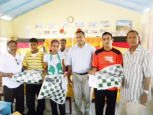 The Guyana Chess Federation (GCF ) visited the Essequibo Coast two weekends ago in tandem with Dr Frank Anthony, whose ministry distributed some chess sets to the Anna Regina Multilateral school, Abram Zuil Secondary and the Cottonfield Secondary school. It was the GCF’s first visit to Essequibo. In photo, teachers from the three schools display their new sets in company with the Minister of Culture, Youth and Sport  Dr Anthony, Regional Chairman Ally Baksh (far left ) and President of the GCF, Errol Tiwari.