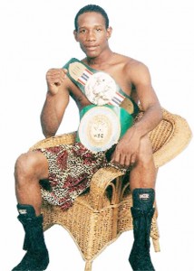 Leon ‘Hurry up’ Moore displaying his WBC Caribbean Boxing Federation (CABOFE) and NABA bantamweight championship belts.