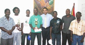 From left to right- VP of East Bank Football Association Clive Matthews, Captain of South Grove Dexter Archer, Moses Fraser, Captain of North Grove Levi Braithwaite, Minister of Sport Dr. Frank Anthony, Clive Matthews Jr., Ministry of Sports Parliament Secretary Steve Ninvalle and Ministry of Sport, Sports Organiser Wayne Francois. (Orlando Charles Photo)