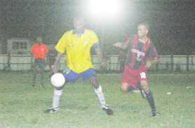  In this Orlando Charles photo Pele’s captain Dirk Archer (Left) controls possession in the Pele/Western Tigers match on Friday. 