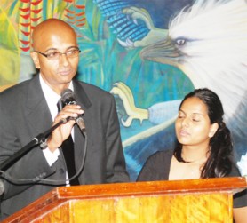 Yuri Chandisingh, son of Ranji Chandisingh, delivers a tribute to his father with his daughter Stacy by his side. (Jules Gibson photo)