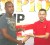 Edward Beharry and Company’s marketing representative Harry Shempaltam (right) makes their presentation to Jamaal Douglas of NLE for their sponsorship of this year’s National School Basketball Festival. 