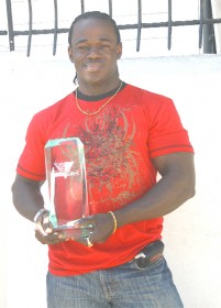 Sylvan Gardener poses with his trophy that he won at this year’s Musclemania which was held in Miami, Florida over the weekend. (Orlando Charles photo)  
