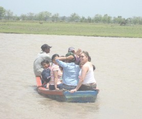 The women and children aboard the boat just before it capsized; looking back at right and waving is Diana Balram. 