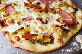 Thin-crust Pizza with pesto, prosciutto, pineapple, ham & salami toppings (Photo by Cynthia Nelson)