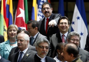 Honduras' President Manuel Zelaya, top center, gestures after posing for the official photo of the 39th General Assembly of the Organization of American States, OAS, in San Pedro Sula, Honduras.