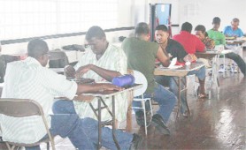  Some members of the Guyana Scrabble Players Association in action. 