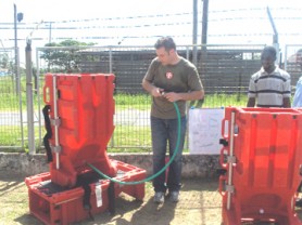 Joseph Molinaro, Product Director of Relief Pod International  LLC, demonstrates the use of the rescue device.  