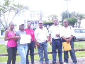 Some of the agents who gathered in front of the CLICO Head Office yesterday.