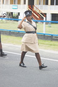 Cadet Officer Halley salutes as she marches past the podium at Eve Leary on Saturday where Commissioner of Police Henry Greene stood during the police’s 170th anniversary parade. (Photo by Jules Gibson) 