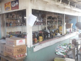 Burnt grocery items outside Bishondai Rajkumar’s stall which was partially destroyed by the fire. (Photo by Alva Solomon) 