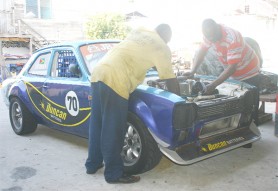 Working overtime! Team Rahaman’s ace mechanics Tedroy Howard (left) and Freddie Mapp were caught by Stabroek Sport photographer Orlando Charles working diligently on Ryan Rahaman’s Ford Escort. 