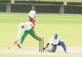 THIS COULD HAVE BEEN NUMBER SIX! Roger Harper barely makes it to the crease during yesterday’s match of sighted versus blind players at the Providence National Stadium. (Orlando Charles photo) 