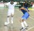 Quarterfinal action - This Santos player (left) tries to move on the attack while being marked closely by a Fruta Conquerors defender (right).  (Orlando Charles photo) 