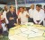 An officer at the Berbice Expo and Trade Fair 2009 explains to President Bharrat Jagdeo the difference between the types of paddy on display.    