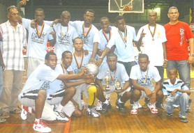 The successful Linden team poses with their championship trophy as Banks DIH’s Carlton Joao (right) and Director of Sports Neil Kumar (left) share the moment. The MVP Orin Rose is seen stooping third from right. (Orlando Charles Photo)     