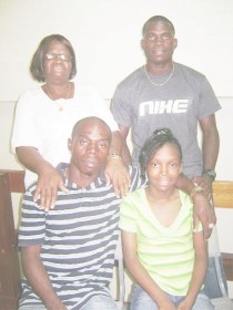 Tianna Blair with her father Godfrey Blair (sitting, left), grandmother Veronica and uncle Edmond Blair standing.