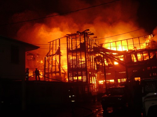 In flames: The Ministry of Health’s main building at Brickdam alight early this morning. The fire erupted some time before 3 am and raged on for some three hours completely destroying the building. (Photo by Iana Seales)