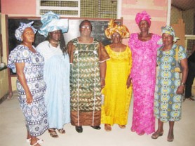 Jane Jones, third from left, posing with Colleen Grant and her mother Agnes Grant (second and fourth from left) and other women, in their African attire. 