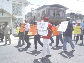 PNC leader, Robert Corbin (right, front row) along with other senior party officials leading off the protest march on Joseph Pollydore Street yesterday.   