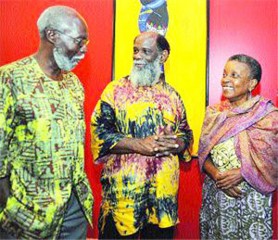 Tracy Wilson, left, Director of Education in the Emancipation Support Committee (ESC), chats with Khafra Kambon, centre, chairman, and guest speaker Andaiye before the final session of the Kwame Ture Memorial Lecture series on Sunday at Queen’s Hall, St Ann’s. (Trinidad Express photo) 