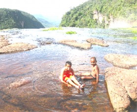 Ravi (right) with Awad taking a dip in the water.