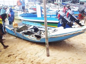 The boat in which the trio was travelling at Parika yesterday. 