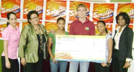 Oliver Kear-Downes flanked by Keisha and Kayla Jeffery as they pose with the sponsorship cheque from Ansa McAl which was presented by Managing Director Beverly Harper (second from left). (Rawle Toney photo)  