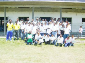 Participants of the 2009 East Coast Cricket Board eight annual cricket academy pose with their certificates following the closing ceremony at the Lusignan Community Centre yesterday 