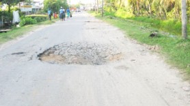 A huge pothole on the road 