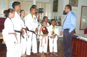 Minister of Culture, Youth and Sport Frank Anthony sharing a few words with Guyana Karate College students who represented Guyana at the ISKF/CKC Championships. 