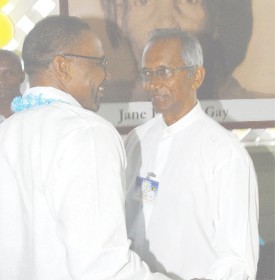 Incumbent PNCR leader Robert Corbin (left) and his challenger Winston Murray exchanging greetings before the start of the party’s 16th Biennial Congress yesterday. (Photo by Jules Gibson)   