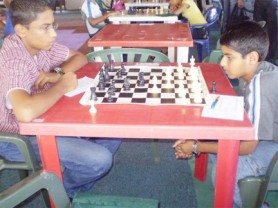 During the recent Topco Juice DDL-sponsored Emancipation Chess Tournament, the junior participants outnumbered the seniors for the first time by a margin of 1.5 to one. A few players from West Demerara played their first tournament in Georgetown and did well. In photo, Aslam Hussein (left) plays Saeed Ali.