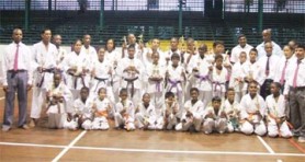 Winners of the JKA/WF National Karate Competition stand with the judges for a photograph. 