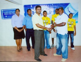 In the photo above, manager of the DDL Berbice Branch, Albert Budhoo, left foreground, hands over the sponsorship cheque to Roberts. Looking on are Bibi Aneesa Sugrim, Accounts Supervisor, Shakefareed Razack, Sales Supervisor and three cyclists. 