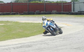 TESTING TIME! Steven Vieira tests his bike on the Bushy Park Circuit in Barbados yesterday. (Rawle Toney photograph) 