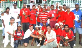The Die Hard Brothers XI team pose with the Trophy Stall Championship Trophy after winning the tournament on Saturday at GCC, Bourda.  