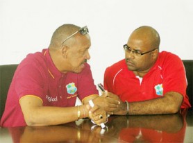 Billy Doctrove makes a point to Digicel’s Media Manager Imran Khan. 