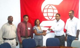 Marketing manager of Scotiabank Jennifer Cipriani-Nelson, hands over the cheque to president of the Guyana Tapeball League, Shane Austin. 