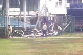 Workmen had to remove builder’s waste from off the ground during the rain yesterday at the GCC ground. The Clive Lloyd stand is currently being torn down to facilitate a modern sporting facility.  