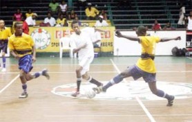 This BK International Western Tigers player (right) goes on the attack against Kitty Northern Rangers as a defender marks closely. (Orlando Charles Photo) 