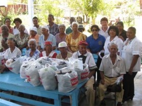 Senior citizens of Mahaica posing with their hampers along with members of the NJASMHM, Guywid and health workers 